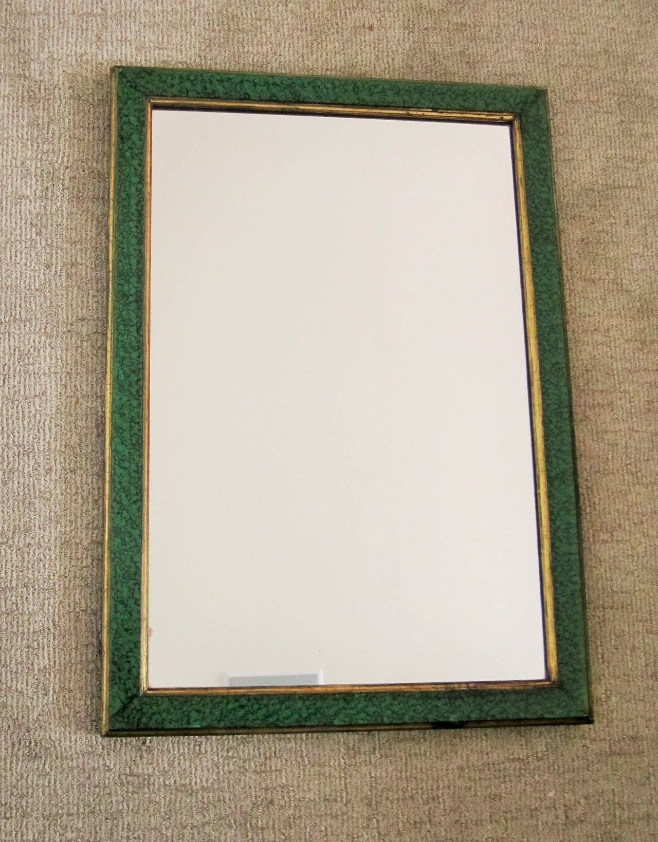 A beautiful and chic green malachite-style lacquer and gold giltwood framed rectangular wall mirror, circa 1970s Modern. Mirror can hang horizontally or vertically. Mirror is prepared to hang vertically.

Mirror measures: 23.5