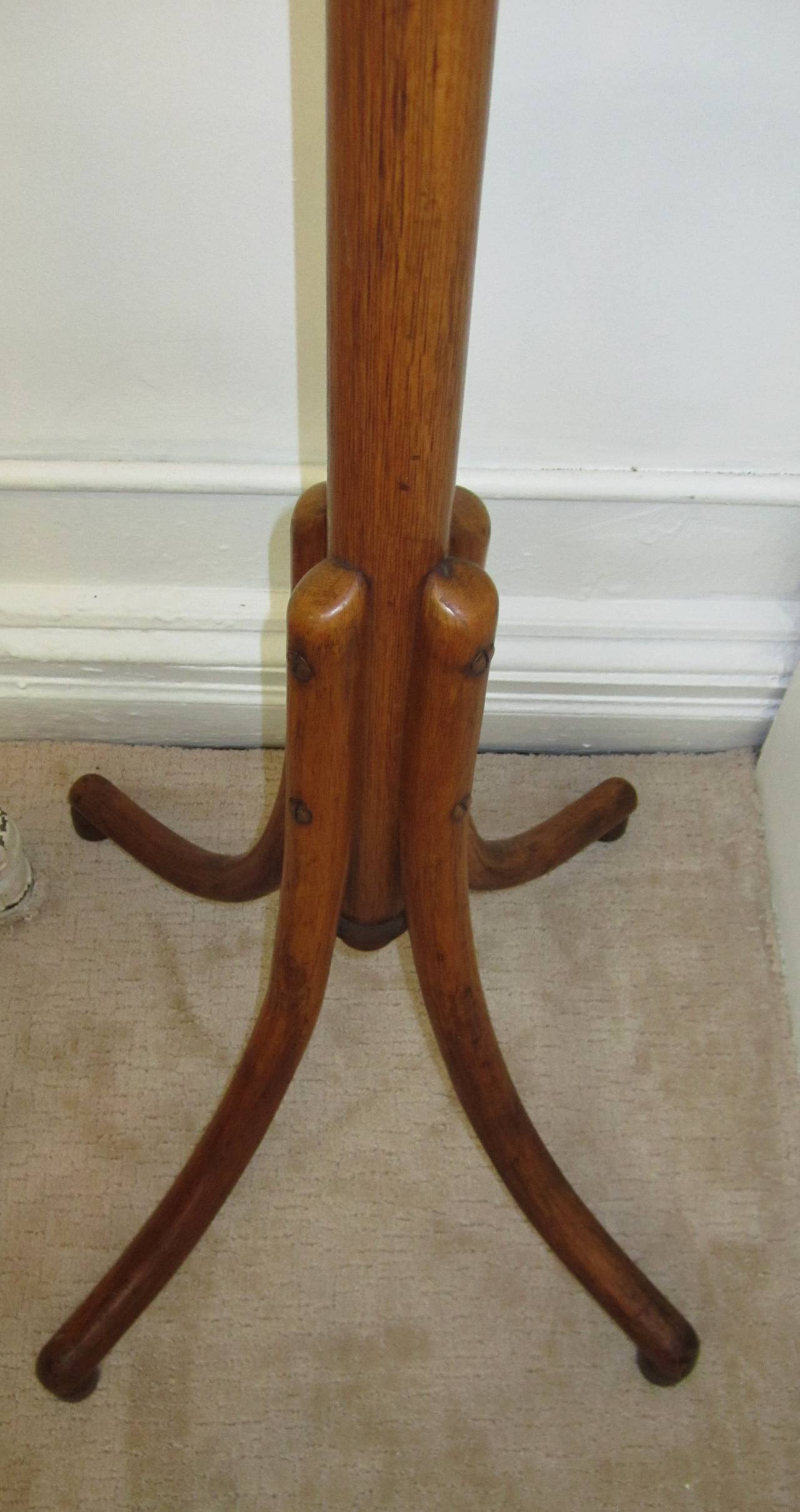 A vintage midcentury bentwood coat rack or hall tree after Thonet. Two rows of hooks, 12 hooks in total. Item available here online. By request, item can be made available by appointment to the trade (in New York).