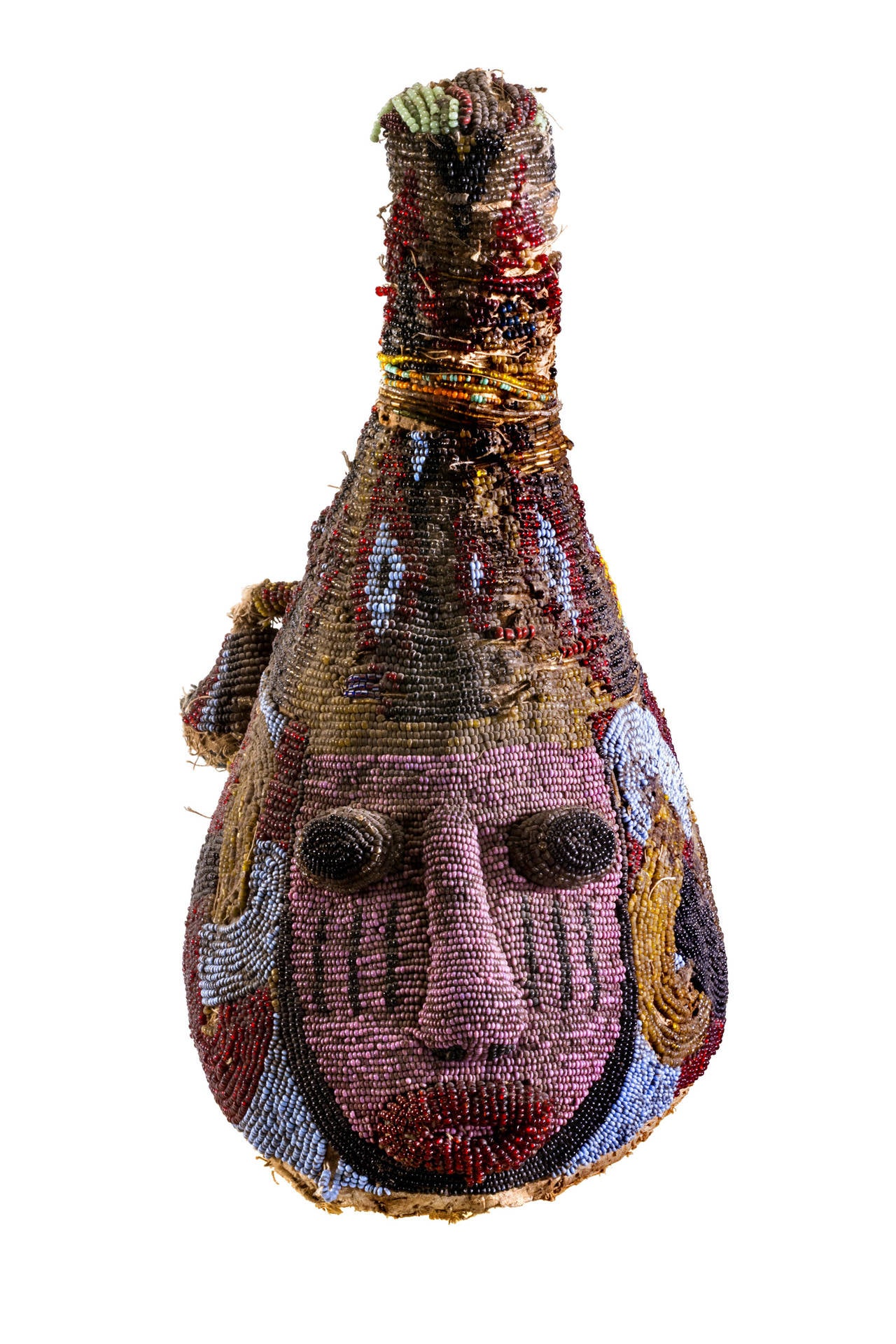 This is one of the old small beaded Yoruba mask from Nigeria. With the face of OBA (King), Eva lasting symbol on one side and birds. The birds are protective of the king. These hats are part of healing costumes worn by a king and Yoruba priest’s