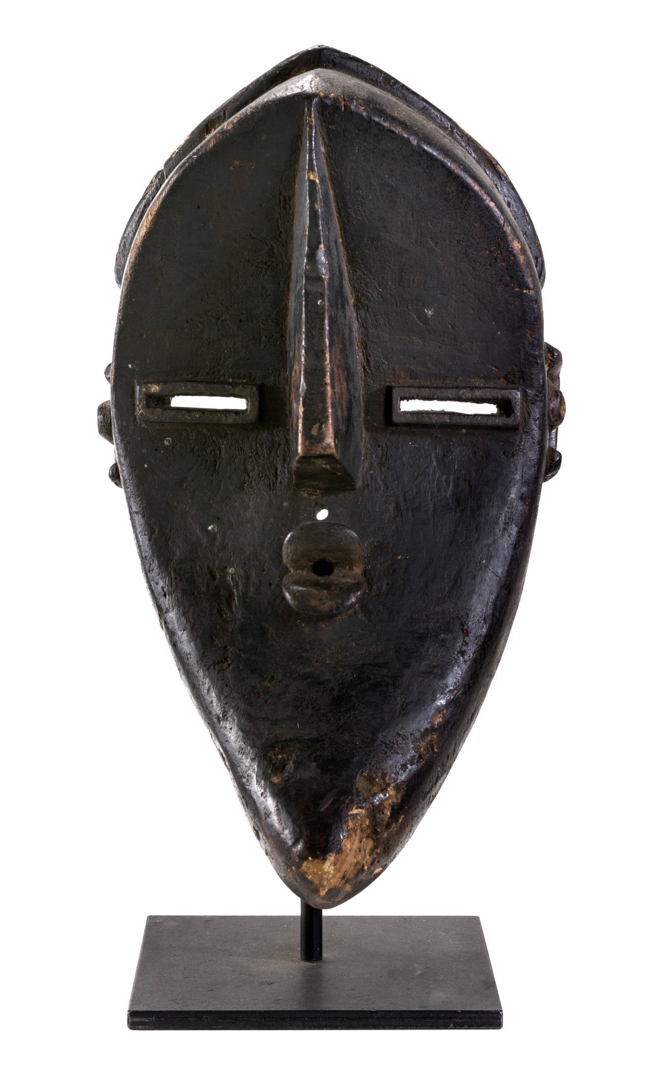 Luwaluwa mask from Congo made in the early 20th century. It has well pronounced cubism Picasso type mouth long noise and rectangular eyes and beautiful ornamented lines which indicate wearing a hat.