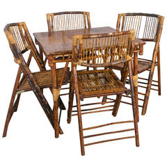 Antique Bamboo Table with Four Folding Chairs