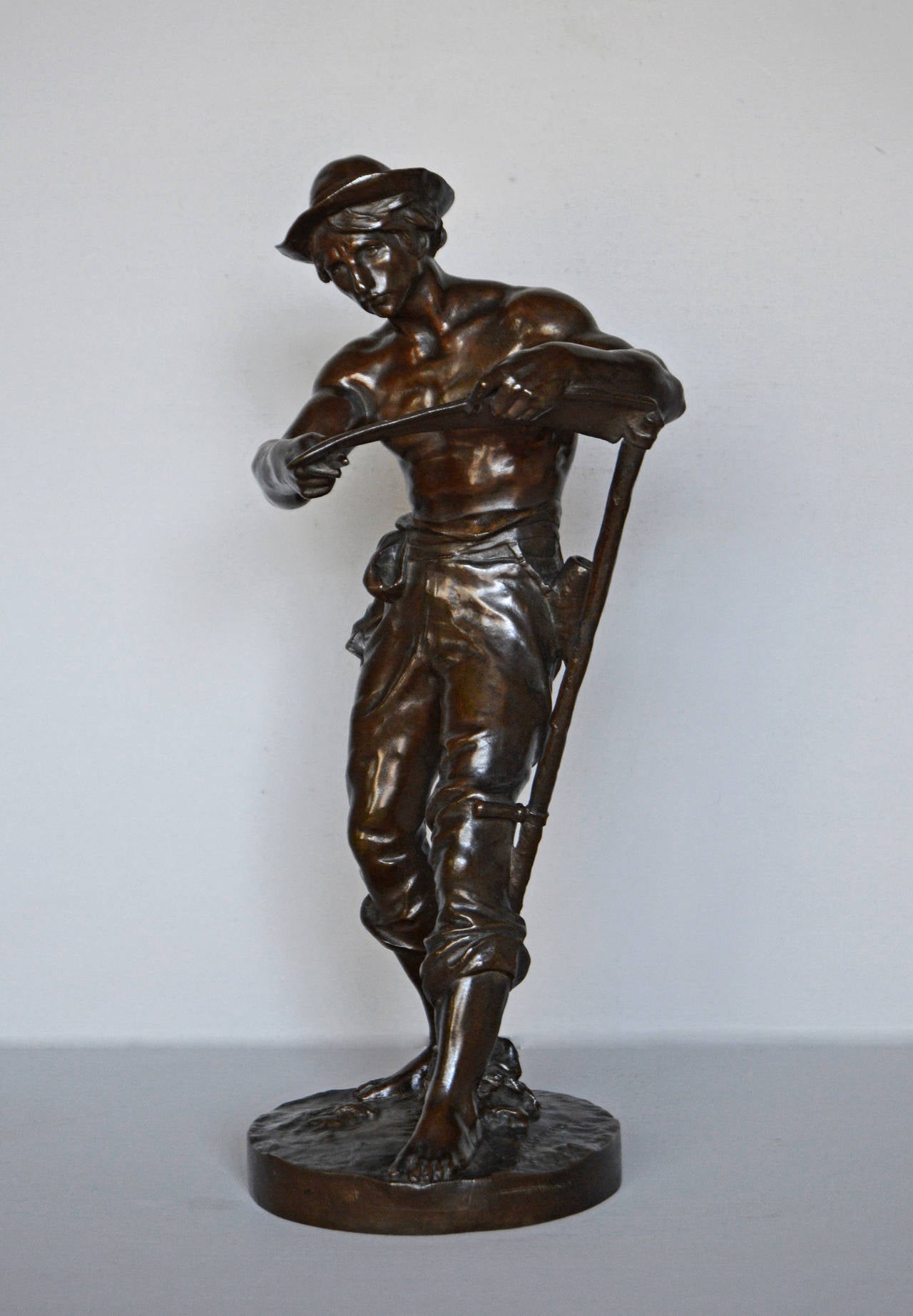 Jean Gautherin 
French, (1840-1890)
Le Faucheur 
Bronze, signed
Height: 13½ inches

Bronze sculpture of a farmer sharpening his scythe by Jean Gautherin, signed 'J Gautherin'.

Jean Gautherin was born in Savault a hamlet of the