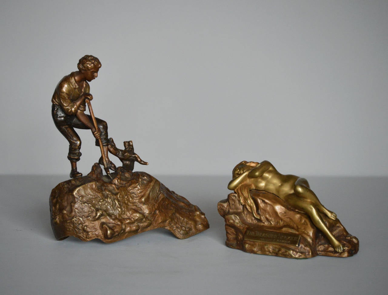 Carl Kauba
Austrian, (1865-1922)
The Treasure Seeker
Bronze, signed
Height: 7½ inches
Width: 5¾ inches
Depth: 2¾ inches

An early 20th century metamorphic patinated and gilt bronze sculpture. A patinated figure of a young man holds a spade