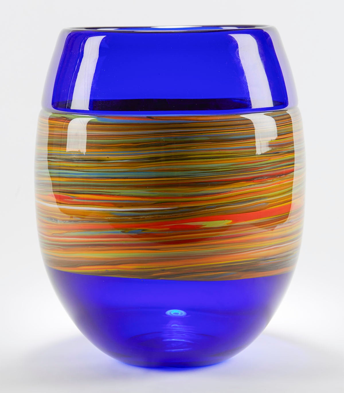 Murano handblown art glass vase by Gino Cenedese with clear blue glass body with an opaque coloured glass swirl design applied around the middle of the vase. This heavily made vase has flat polished and signed base. 

Gino Cendese is one of the