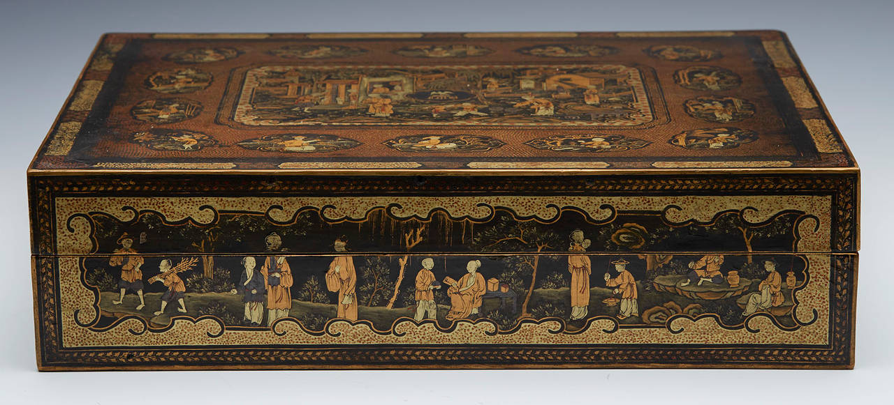 A Chinese armorial lacquer games box including 93 gaming counters with armorial crests for Bell and dating from around 1840. The box has a detailed central scene from Chinese life surrounded by smaller vignettes. The lid also bears the a central