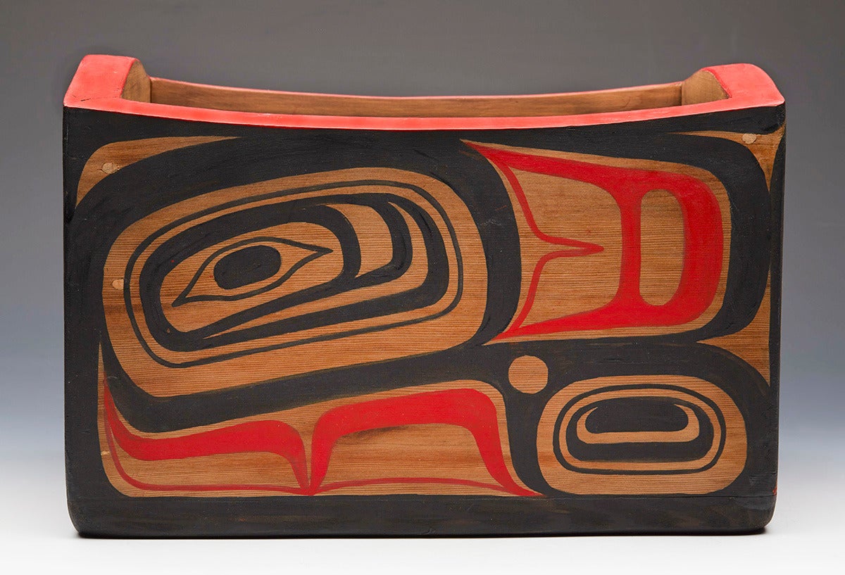 Originating from a private collection of Northwest Native American and related art is this fine unique Haida carved red cedar bentwood bowl hand painted with stylised bird designs in black and red by Beau Dick. This finely made wooden rectangular