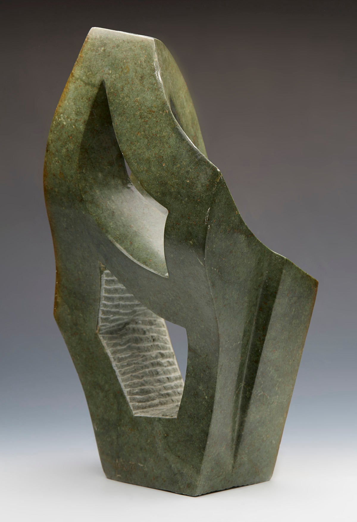 A opalstone sculpture by renowned Zimbabwean artist Lincoln Muteta (b.1975). Many of his works are inspired by plants and other forms created by his active imagination and respect for his Shona culture. Mustefa states 