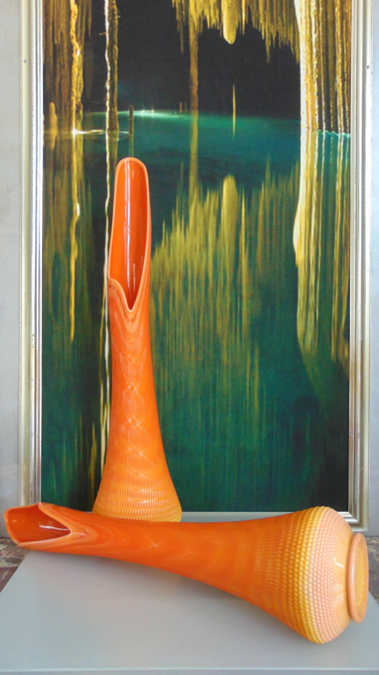 A rare monumental pair of Venetian style glass vases, circa 1970. 
This bright orange/yellow pair of vases has a wonderful unique opening, with the appearance of melted glass. 
They are 36