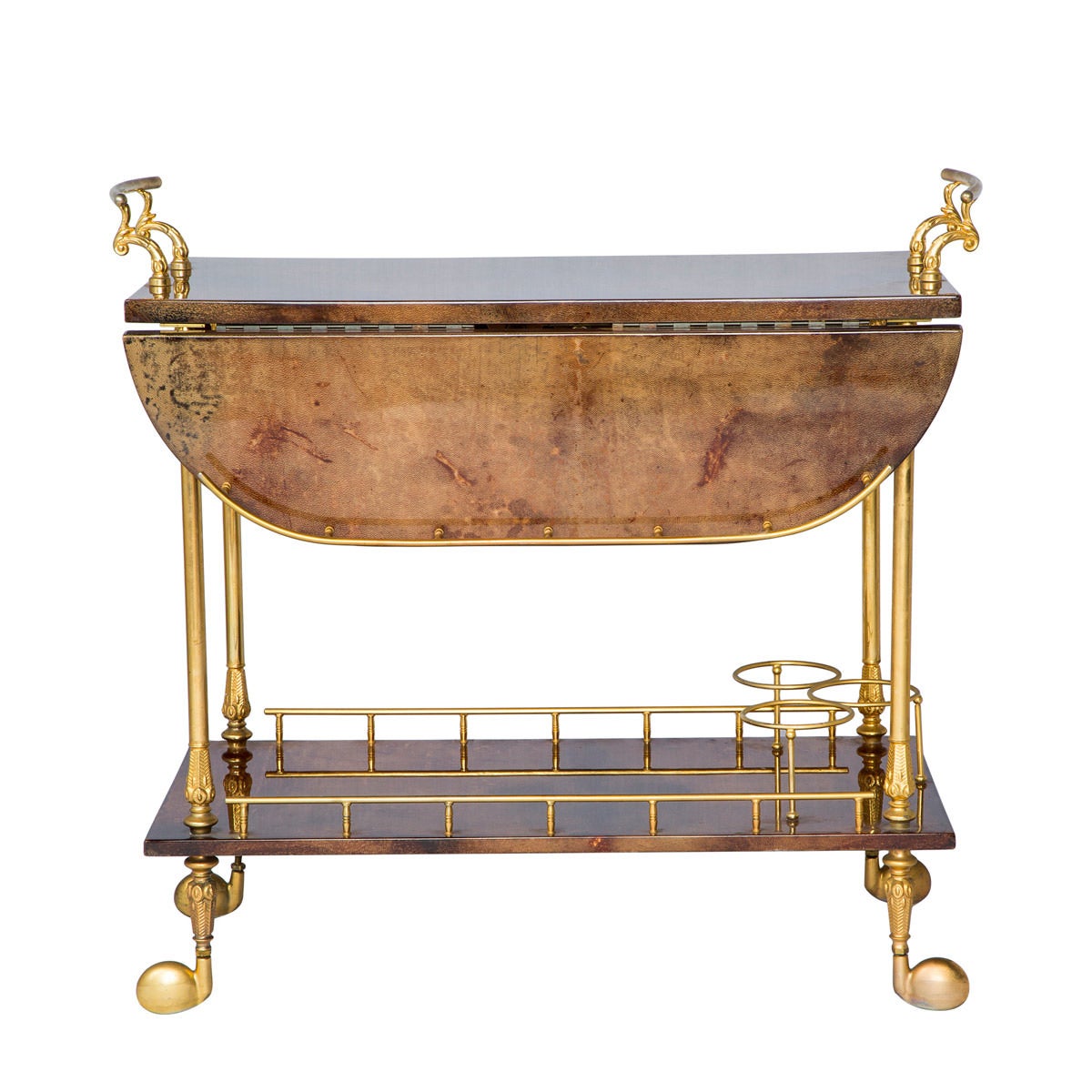 Regency style tea cart by Italian designer Aldo Tura, circa 1950s-1960s with a flare of early 1920s Art Nouveau, this vibrant piece is made from lacquered goatskin and brass structural features. The bottom shelf has three bottle holders. In great