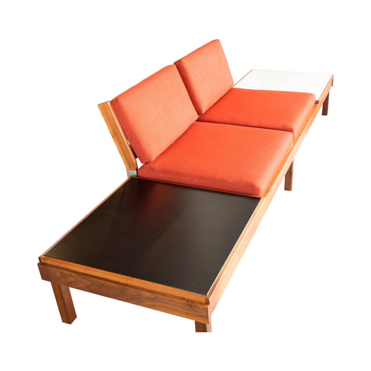 This beautiful, orange modular sofa set by Martin Borenstein for Brown & Saltman is a true Mid-Century Modern treasure, it sits low to the ground for the ultimate lounge vibe. The seats, armrests and black and white tables can be rearranged to
