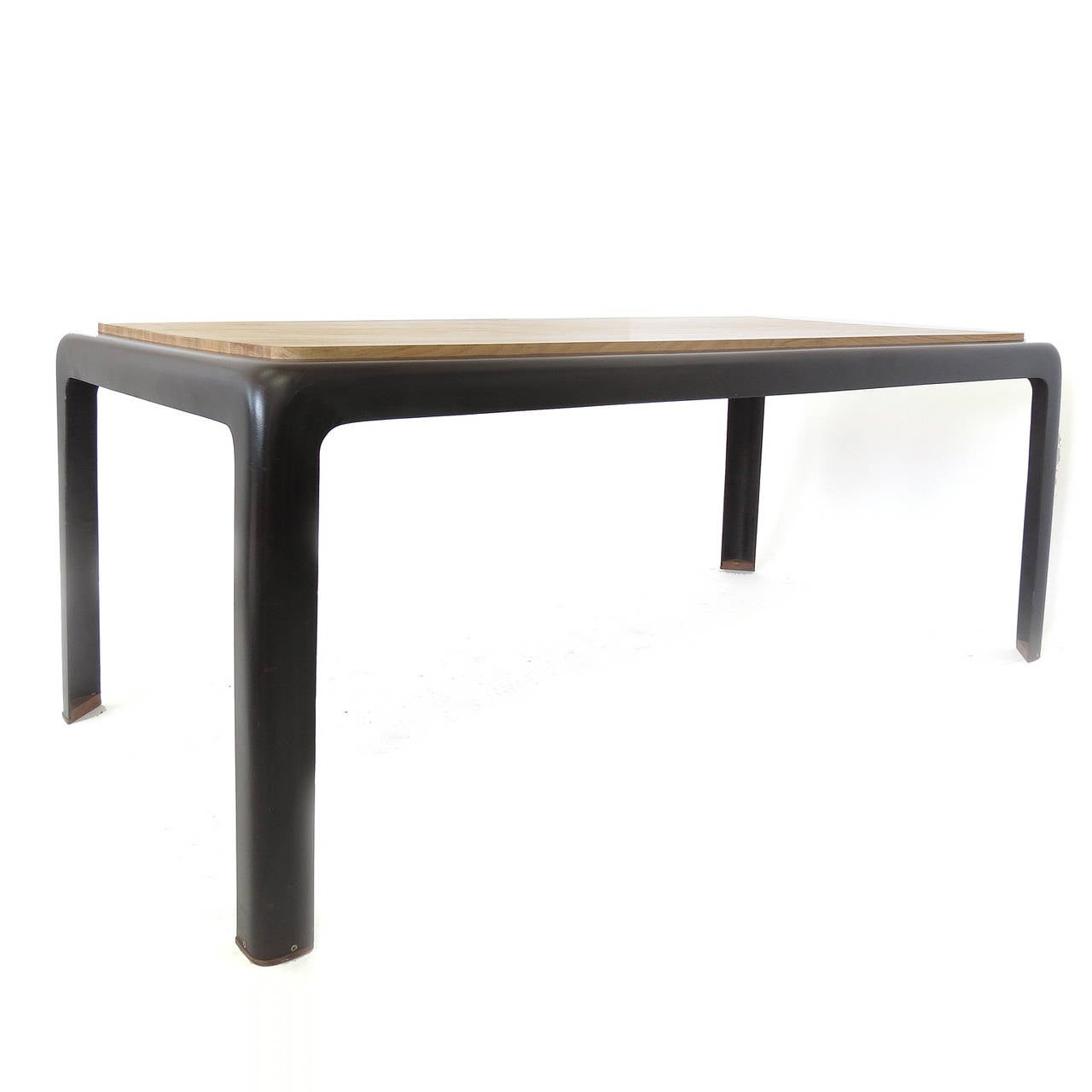 Unique brown fiberglass and oak table or desk with a wooden feet detail.