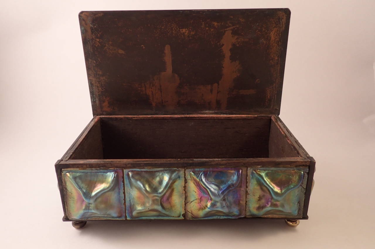 Aristocratic Tiffany Studios turtleback and bronze utility box adorned with a dozen well defined inserts encircling the circumference. The inserts are green and blue with good texture and reflect a beautiful rainbow iridescence. The flat bronze