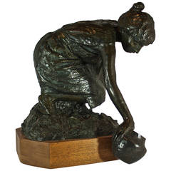 Used Bronze Woman Scooping Water Sculpture
