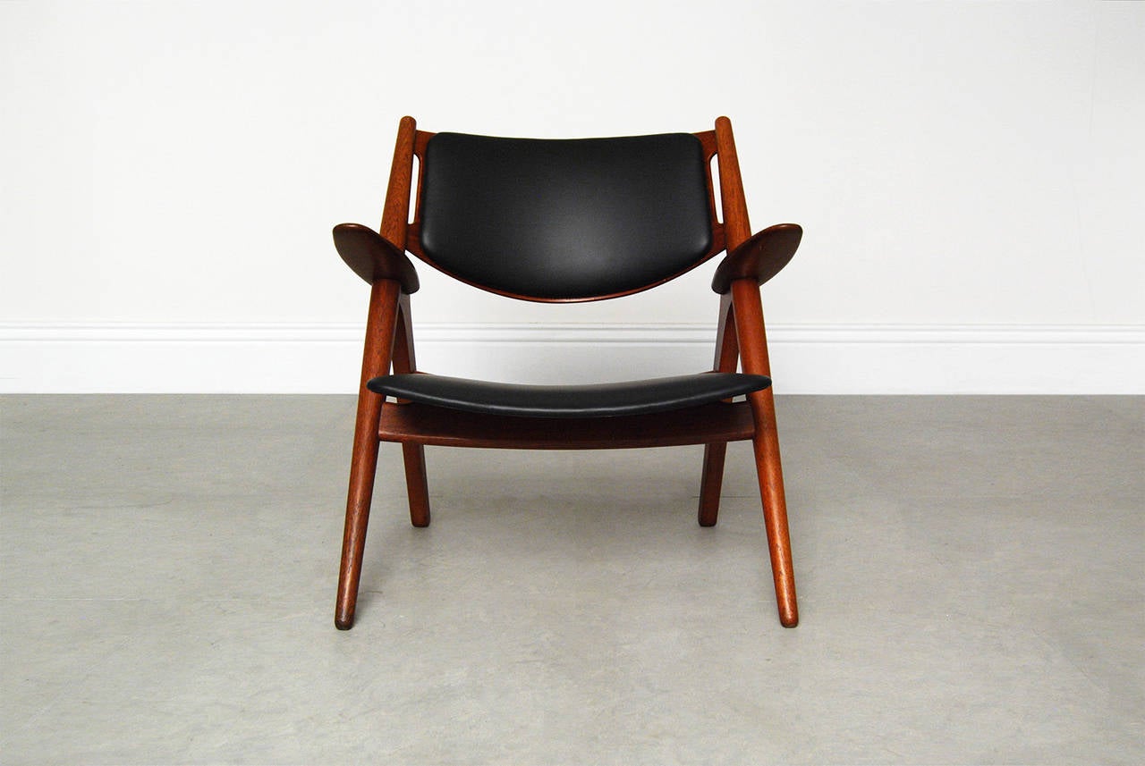 One of Hans Wegner's most iconic designs, this rare early example of the Sawback chair comes in teak with new leather seat and back rest. Designed in 1951 and manufactured by Carl Hansen & Son of Denmark, this is Wegner at his very best, a design