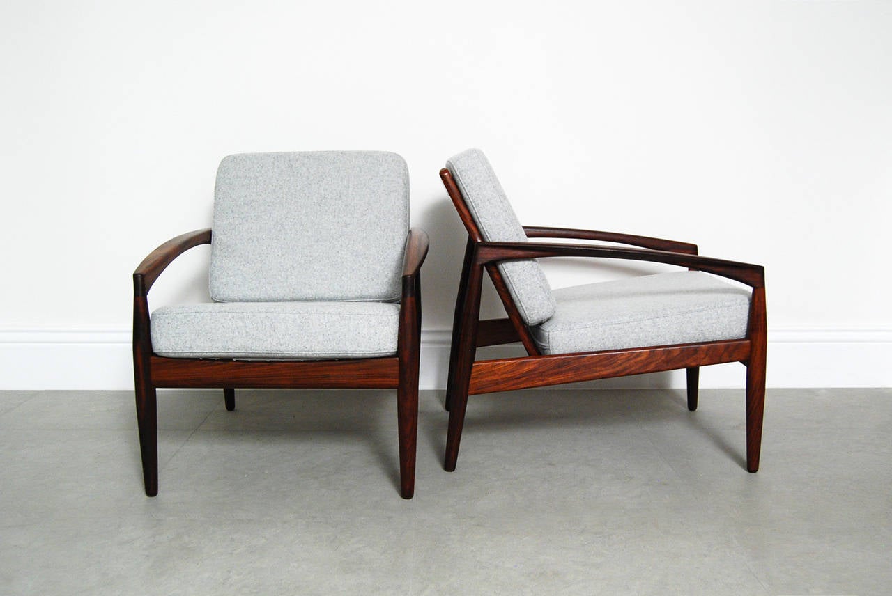 A pair of Kai Kristiansen's iconic Paper Knife chairs in beautiful Brazilian rosewood. Designed in 1955 and manufactured by Magnus Olesen, Denmark, the Paper Knife is a true Classic and remains incredibly sought after to this day. This pair comes