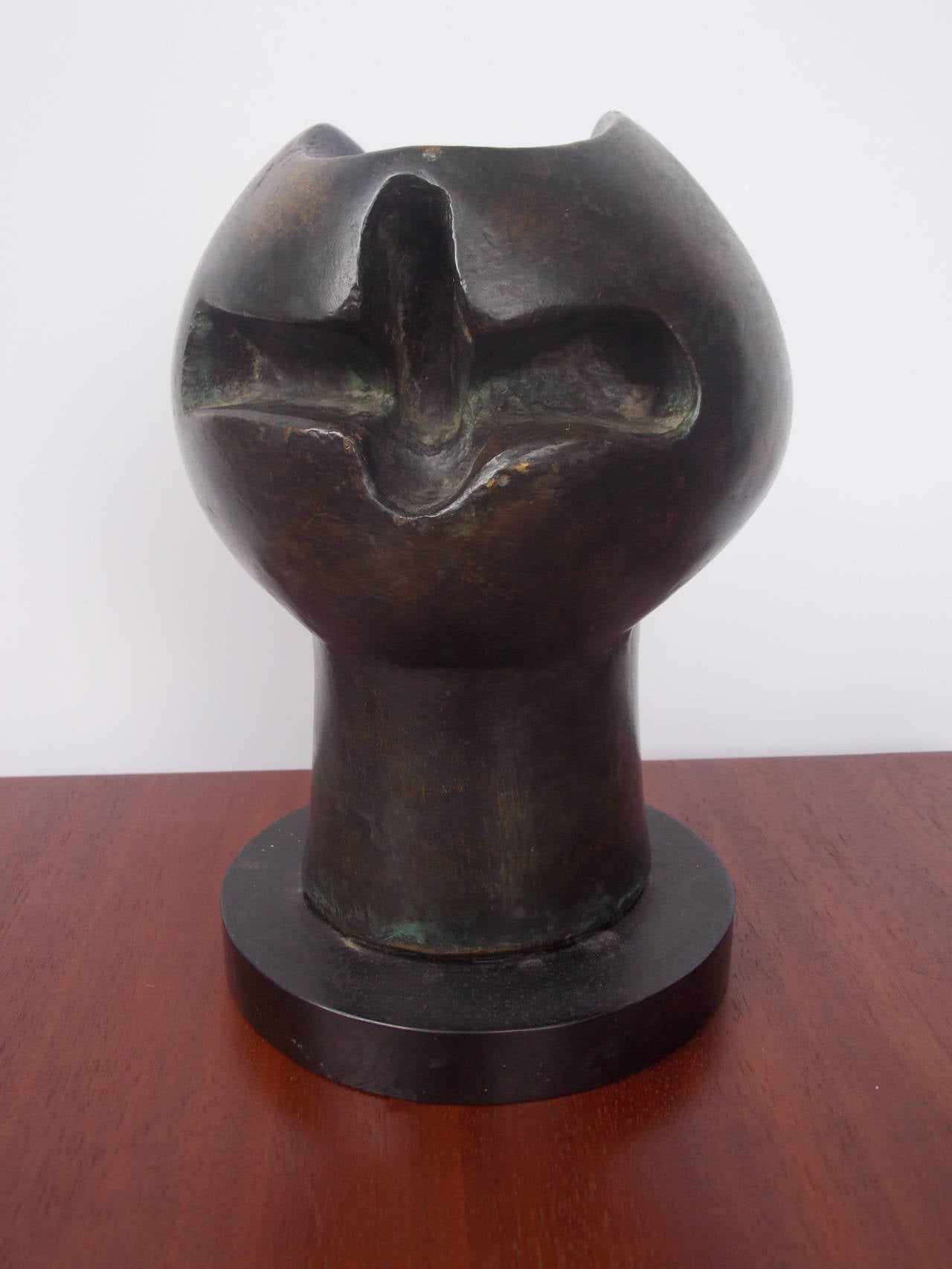 An interesting bronze sculpture on black marble base.
It has remnants of labels. 
It shows patina on the form and ware on the base.
In original condition.