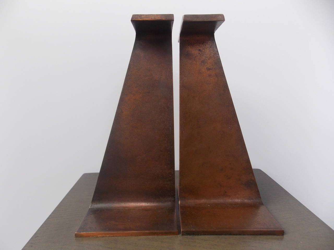 A nice pair or bookends that can be used individually as art objects.
Made of cast steel with bronze plating.