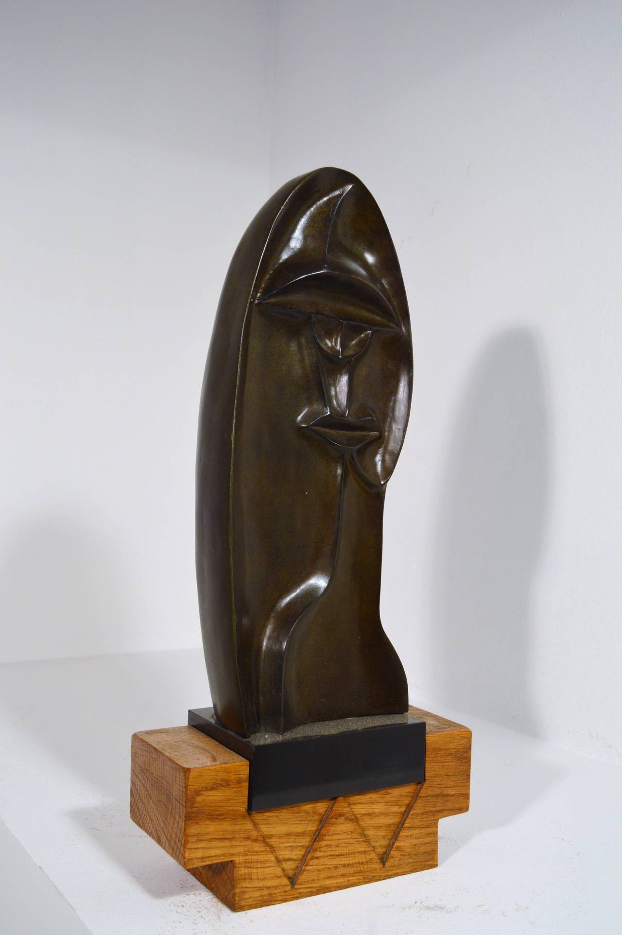 Brown and green patinated sculpture in bronze, created in France by Daniel Ghiatza, dated 1973.