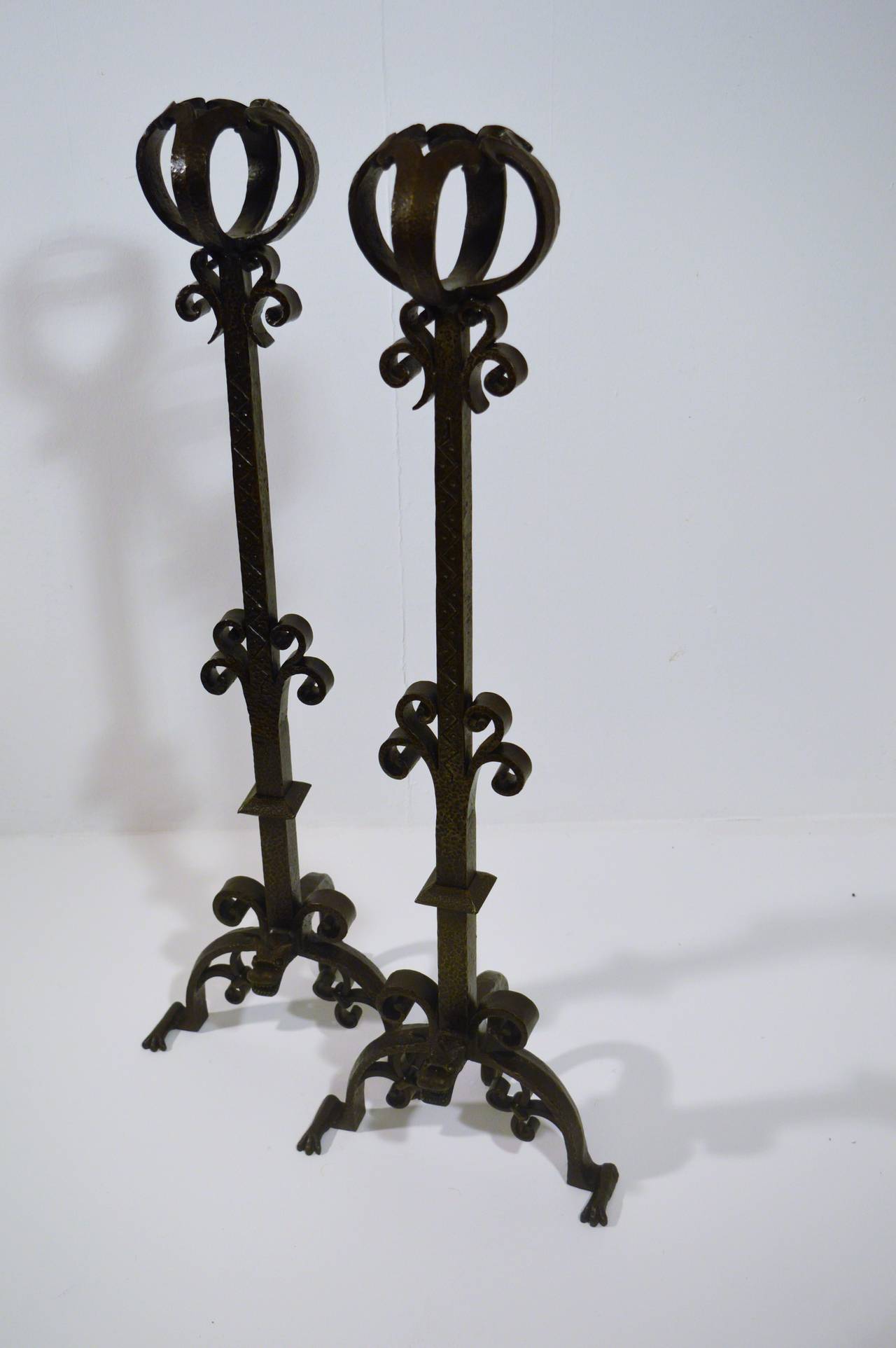 Very interesting wrought-iron chenets, circa 1900, with some very artistic detaills.