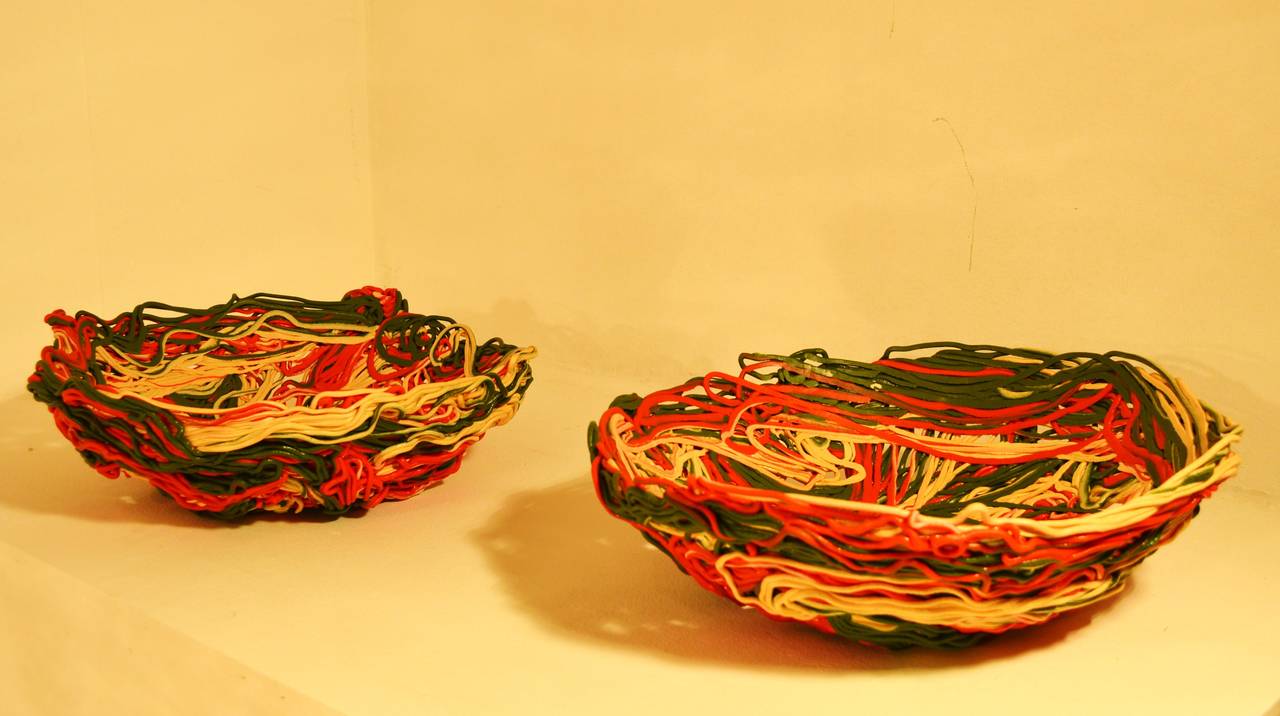 Massive extruded resin baskets in the tri-color of Italy, designed by Gaetano Pesce for the Fish-Design production. Both baskets are numbered and in an excellent condition.