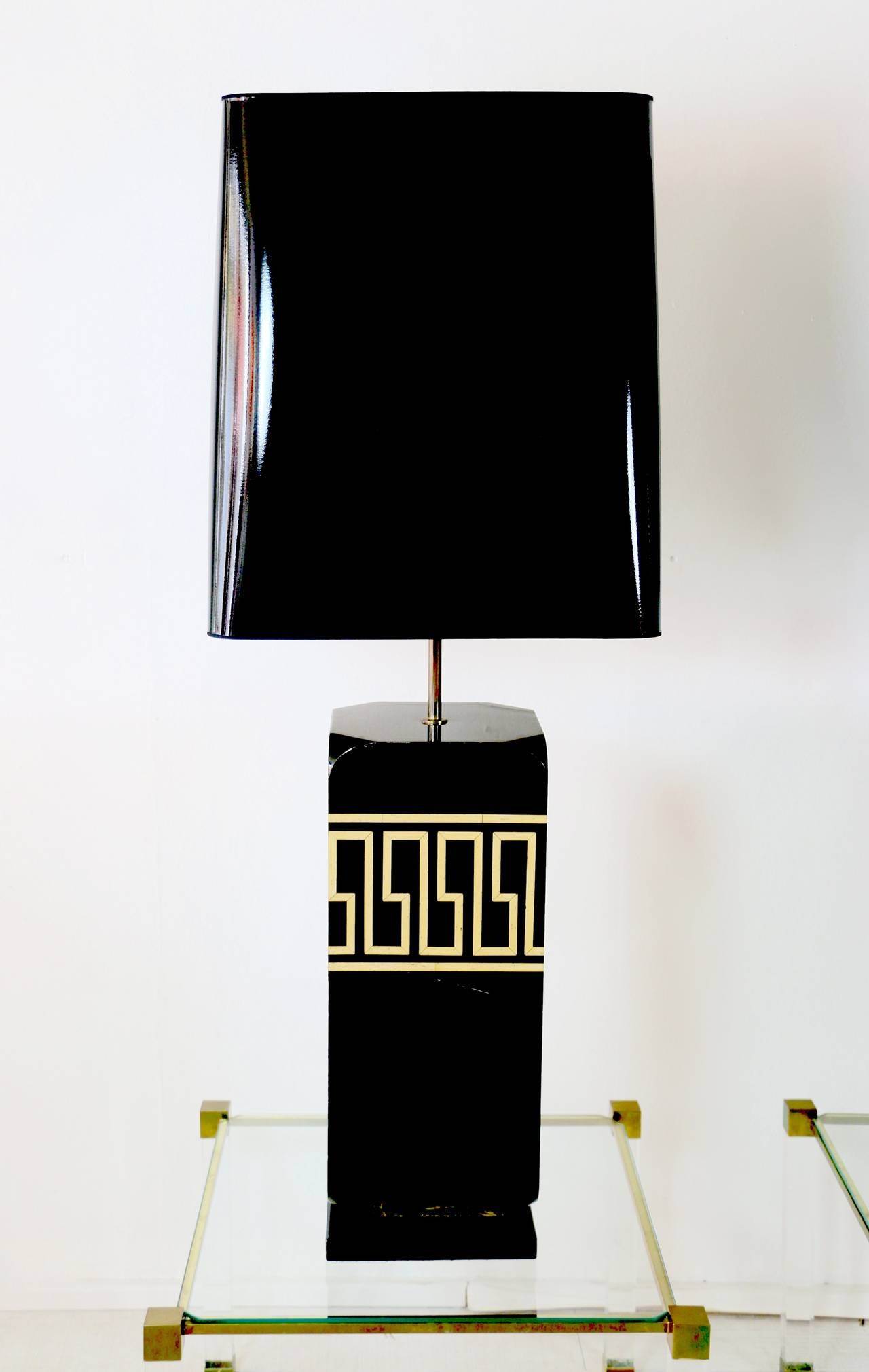 Large 1970s black lacquer table lamps in the style of Jansen. Greek inspiration patterns. New lampshade redone according to the original.

Base dimension: Height 60,5cm x Length 24cm x Depth 24cm
Adjustable lampshade height.