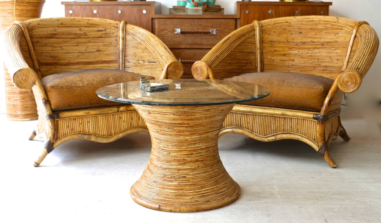 Bamboo 1970s coffee table with a beveled glass top and separate stand

Dimension: 
Coffee table: Height 47cm x Diameter 75cm
Stand: Hieght 92cm x Diameter 40cm