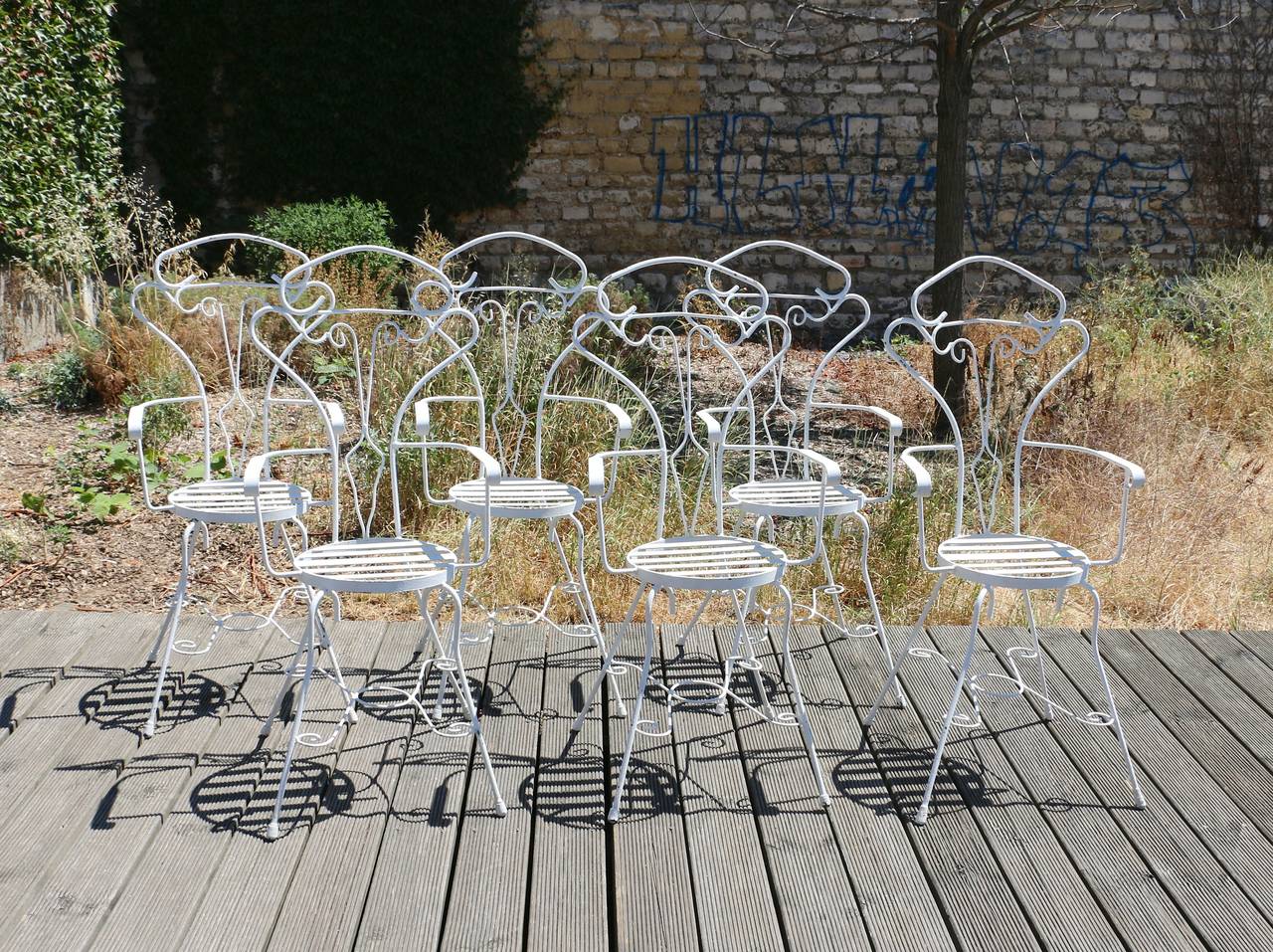 Garden set of six anthropomorphic iron chairs, France, circa 1960