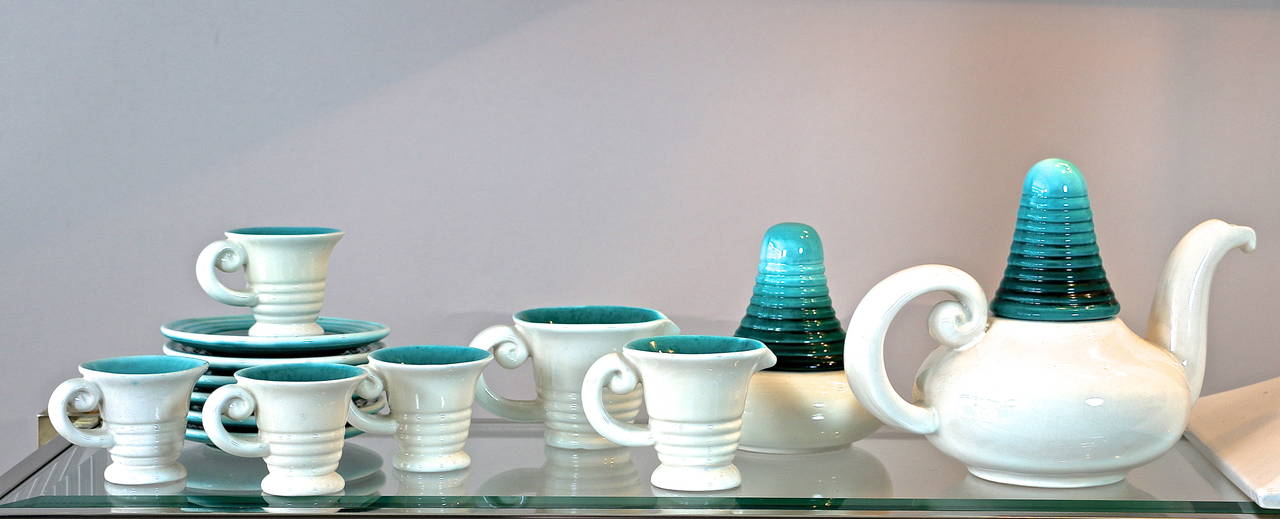 Giraud - Vallauris
Glazed ceramic tea set Vallauris composed of a teapot, a sugar bowl, a small and a large milk jug, four cups and six dishes.

Dimensions:
Teapot: H 20 x W 27 x 16 cm
Sugar Bowl: H 15 x ø 14 cm
Large milk jug: H 8,5 x W 15 x