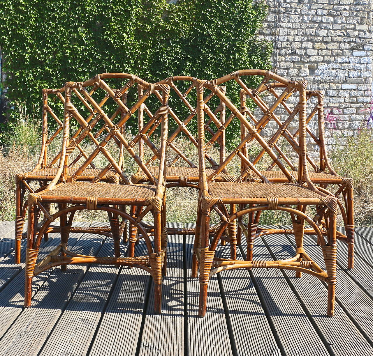 Six bamboo chairs with canned seats, circa 1940.