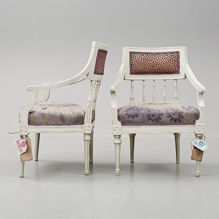 Chair 'Violet Victoria' belong to a set of two identical late Gustavian Swedish chairs from 1775-1810. It has a curved back with vertical slats and a rectangular backrest. The chairs are adjusted to MOMIQ design. The front has been upholstered with