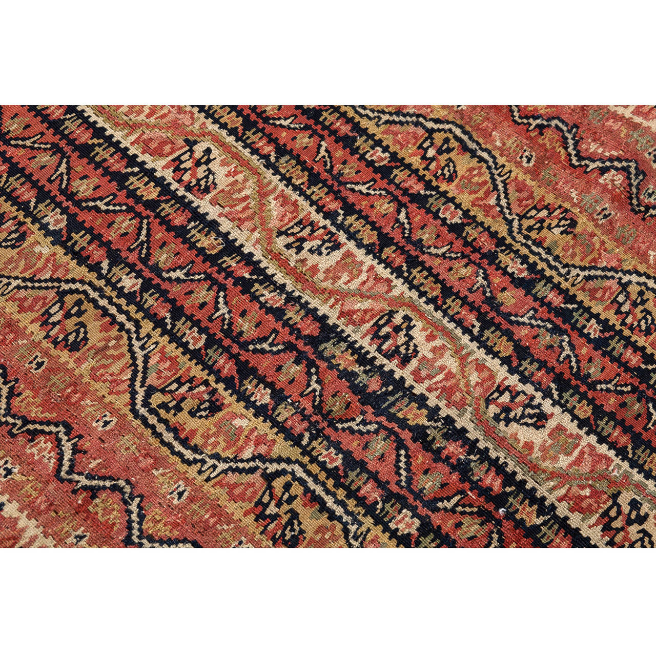 Senneh kilims represent a unique type of Persian slit-tapestry in that they are not only very fine and pliable, but they also reproduce the delicate wrought detail of Senneh pile rugs.

The present kilim is an antique piece, dated c. 1870. It has