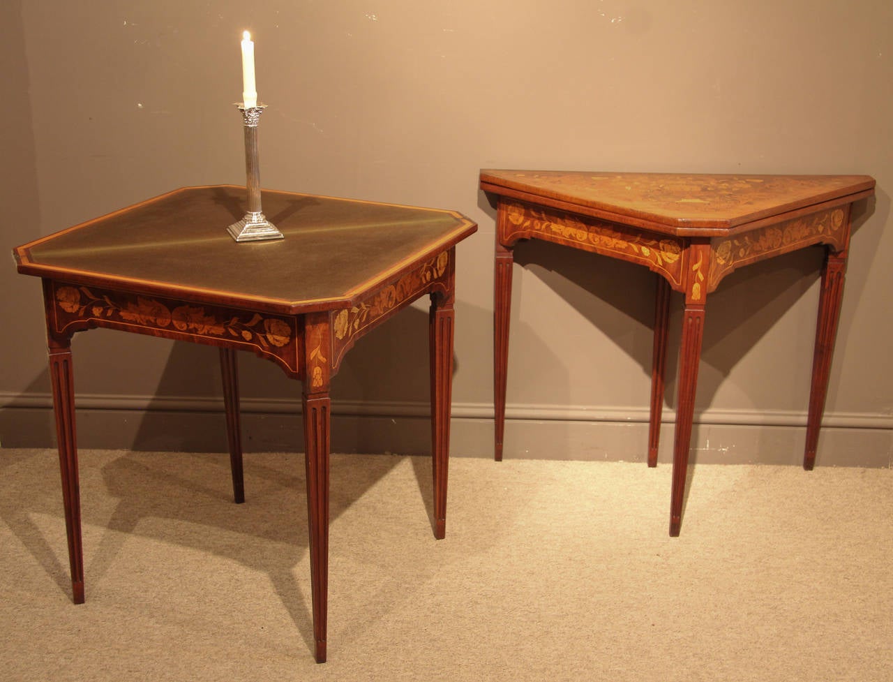 A rare and very attractive pair of Dutch marquetry card tables with baize lined interior. The three sided form with fourth leg pulling out to support the top, circa 1850. 

All of the items that we advertise for sale have been as accurately