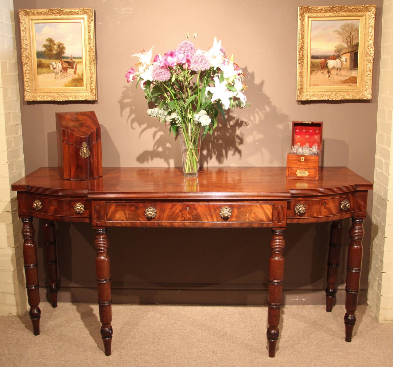 A superb Regency period breakfast serving table/sideboard in mahogany with original gilt brass handles and ebonised details. Certain features would indicate Jersey origin, circa 1820. 

All of the items that we advertise for sale have been as