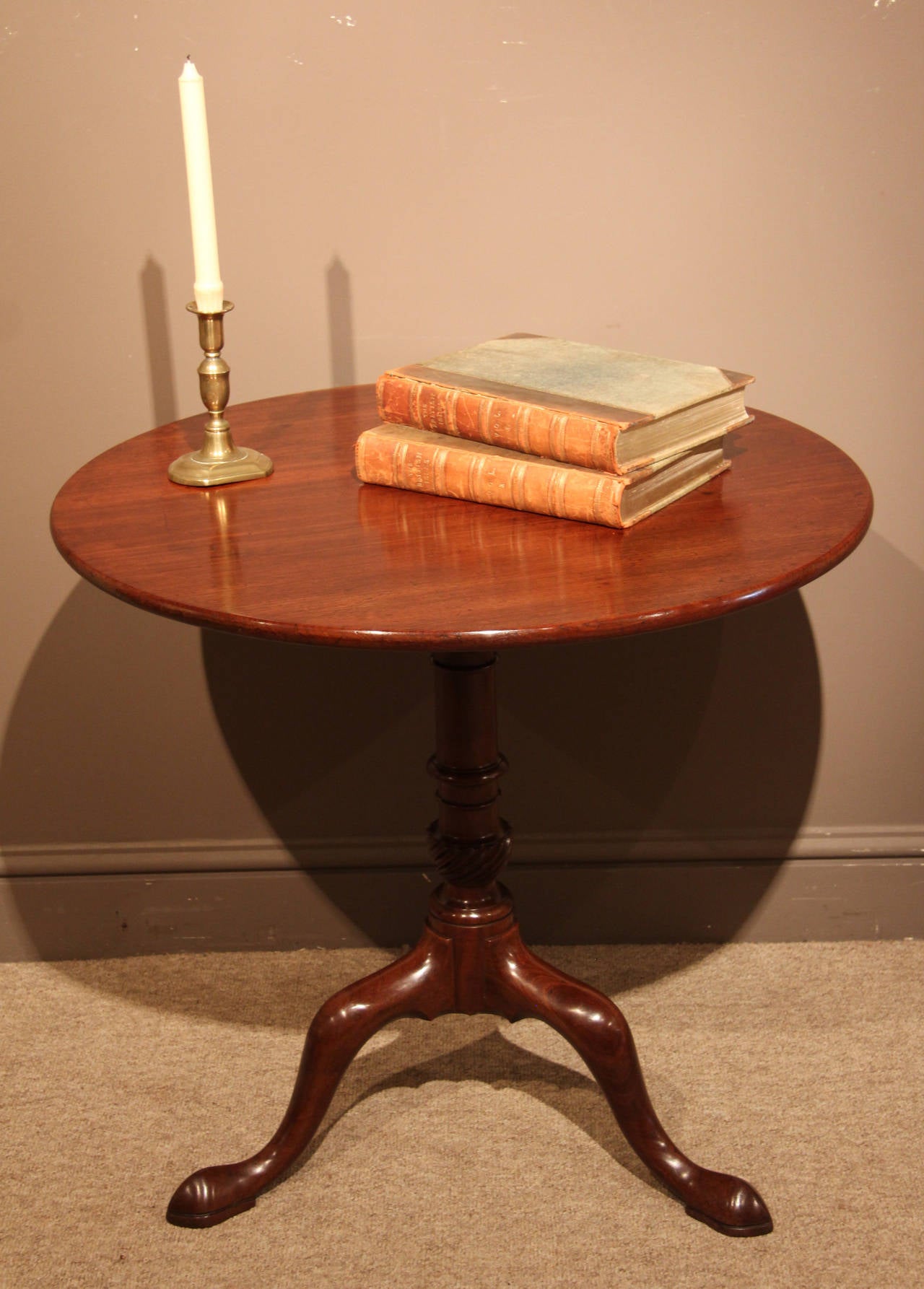 An attractive George III mahogany bird-cage tripod table with single piece top. Having good mellow colour and elegant splay legs with pad feet, circa 1770. 

All of the items that we advertise for sale have been as accurately described as possible