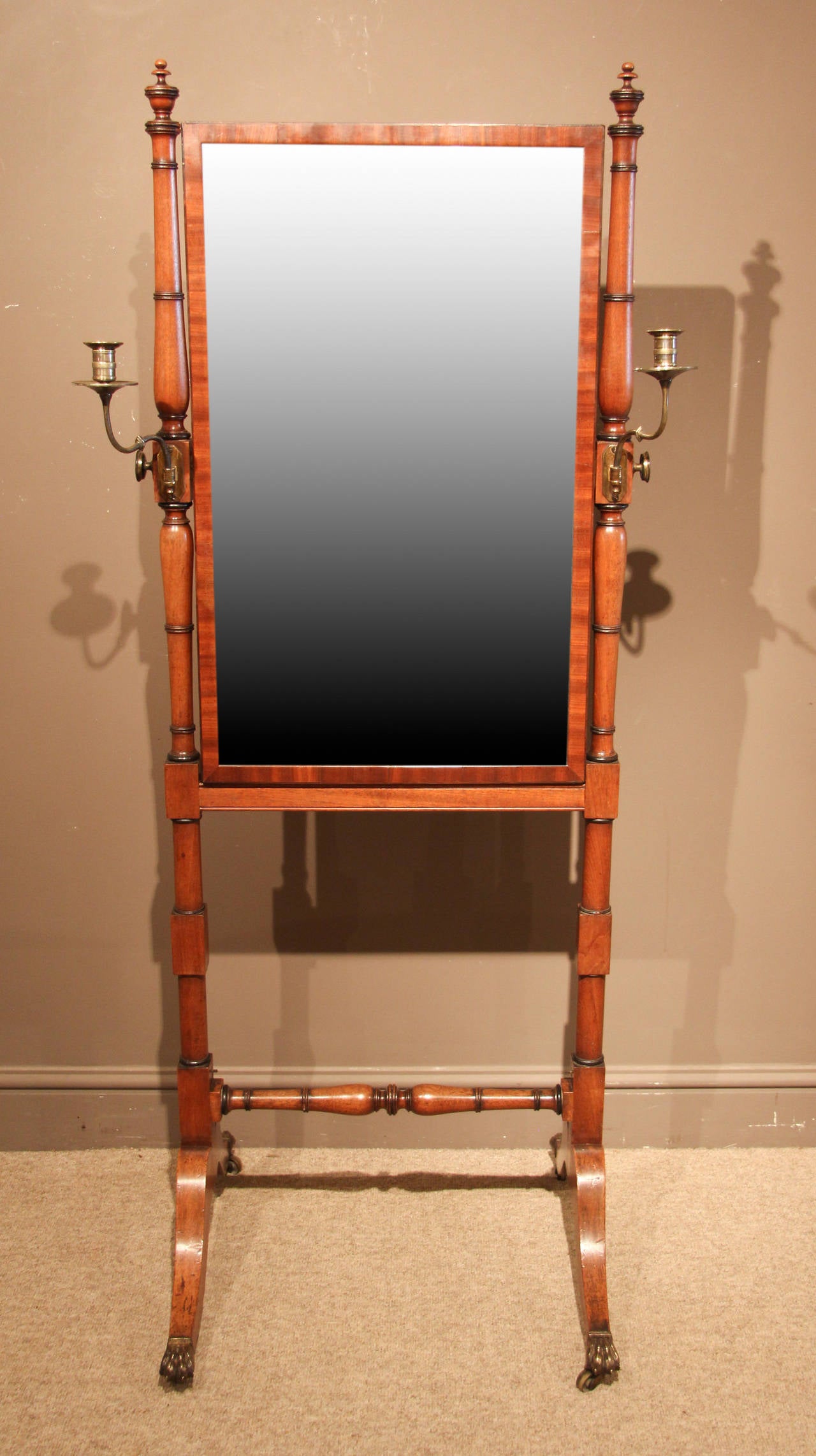 A rare Regency period mahogany cheval mirror with candle stands. Rare campaign/travelling feature, circa 1810. 

All of the items that we advertise for sale have been as accurately described as possible and are in excellent condition, unless