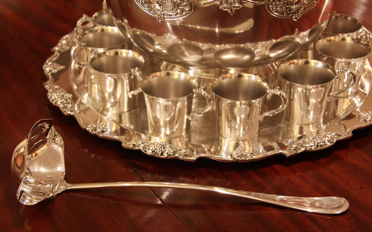 Wallace Baroque silver plated punch bowl set. Consisting of bowl, tray, twelve cups and label. American, circa 1950's. 

All of the items that we advertise for sale have been as accurately described as possible and are in excellent condition,