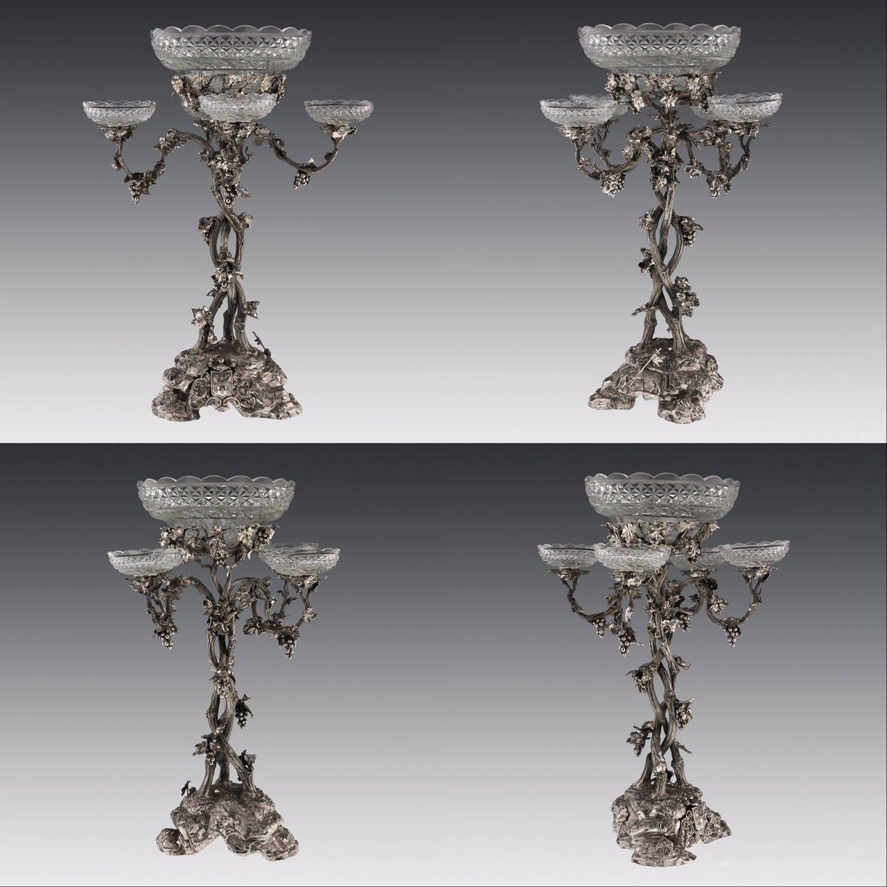 Antique mid-19th Century rare and magnificent Victorian Solid Silver three-piece table garniture / candelabra centerpiece, composing of three massive four-light candelabra.

The central one is surmounted by a cut-glass bowl and the detachable