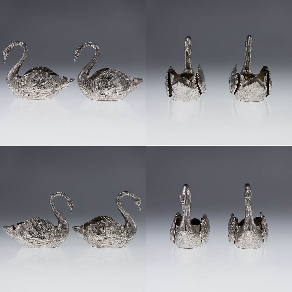 Antique 20th Century pair of German Solid Silver wine bottle holders, parcel gilt, beautifully modelled in the shape of a swan with hinged wings, extremely detailed, decorative and well refined. The pair is quite large and perfect for holding small