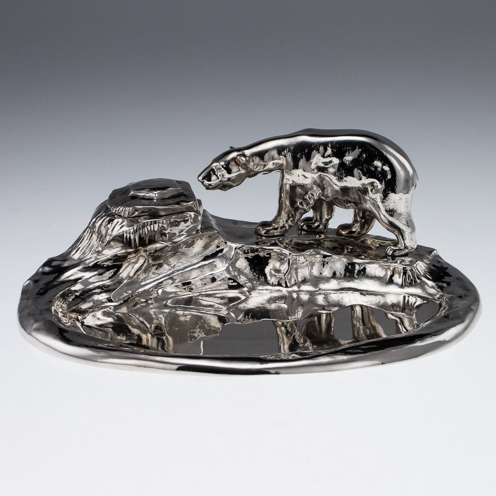 Antique 20th Century exceptionally rare Danish Solid Silver Novelty desk inkstand, massive size, realistically modelled as a frozen pond with a icy shore, mounted with a large polar bear walking on top of it. The frozen ice mound with a hidden