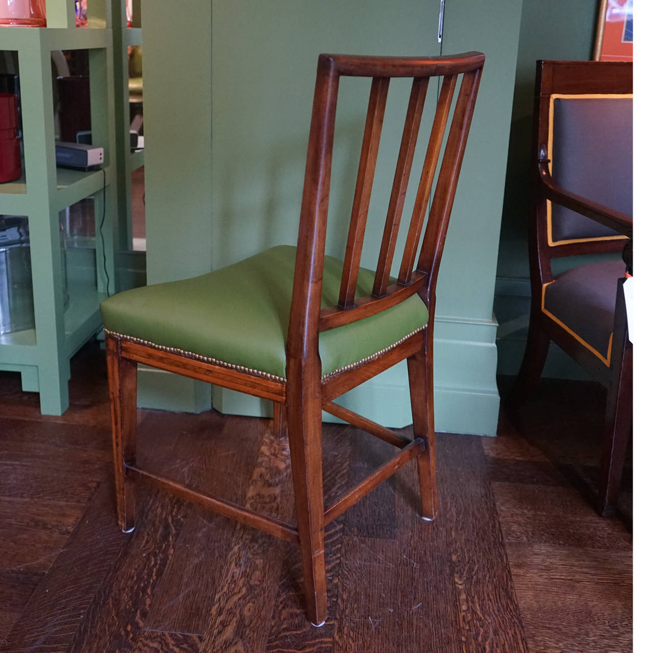 Set of six 19th century English dining chairs with string banding inlay. Newly upholstered in green leather with antiqued brass nailheads.