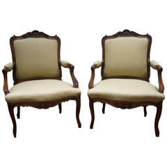 Late 18th Century Pair of Louis XV Style Carved Walnut Fauteuils