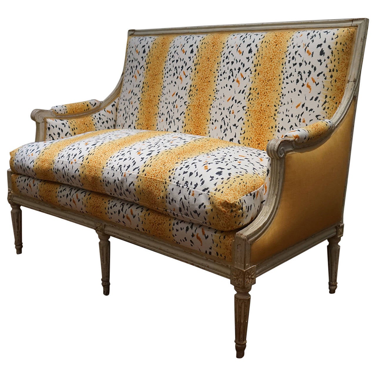 Painted Louis XVI settee with tapered and carved legs with rosettes. Newly upholstered in Bob Collins 