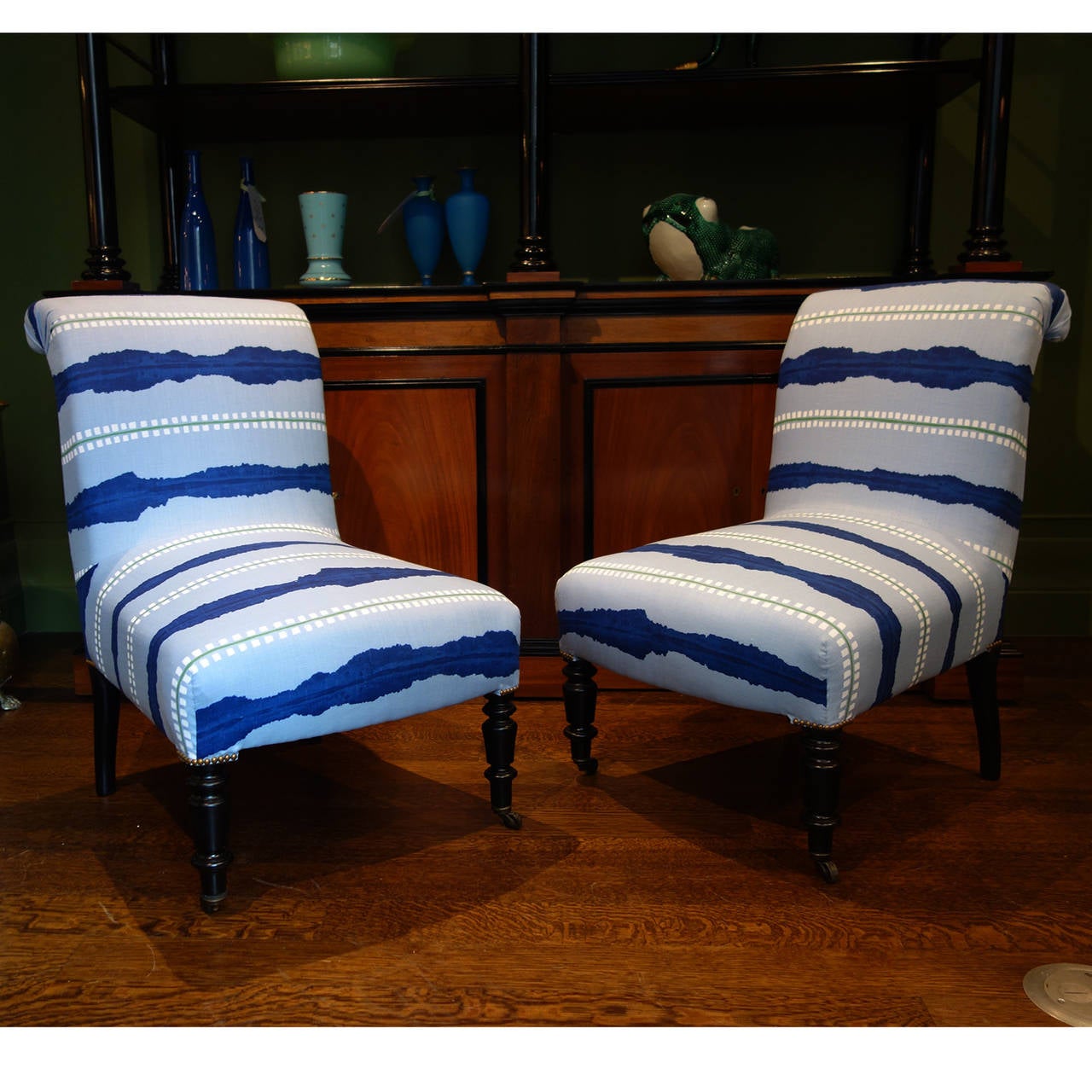 Pair of late 19th century slipper chairs newly upholstered in Konstantin Kakanias striped linen with nailhead detail at corners.
