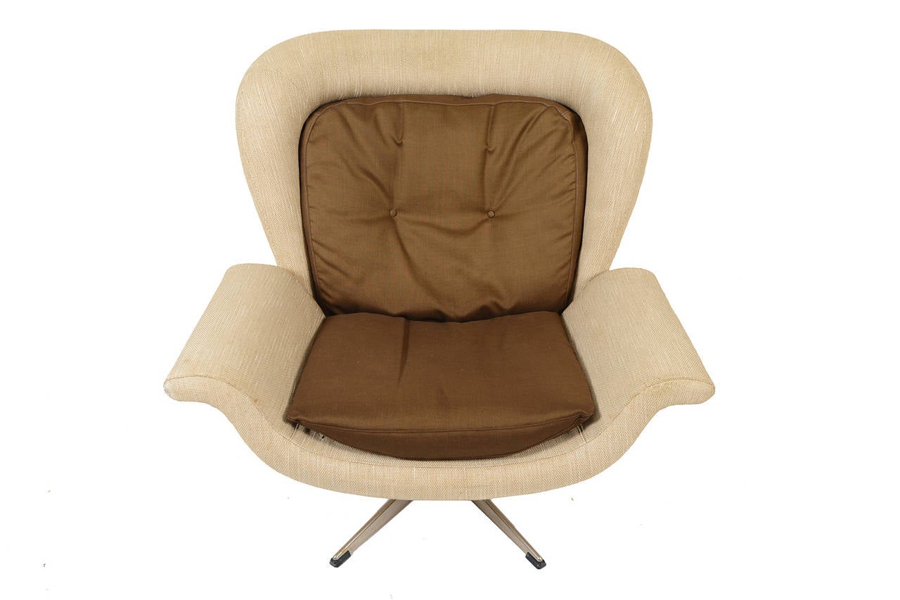 This awesome swivel chair was designed by John Mortensen for Viby J. PMJ for a 1965 exhibition. Created as a prototype, this chair is truly one of a kind! The spacious tulip design features delicately curved armrests and a rounded winged headrest,