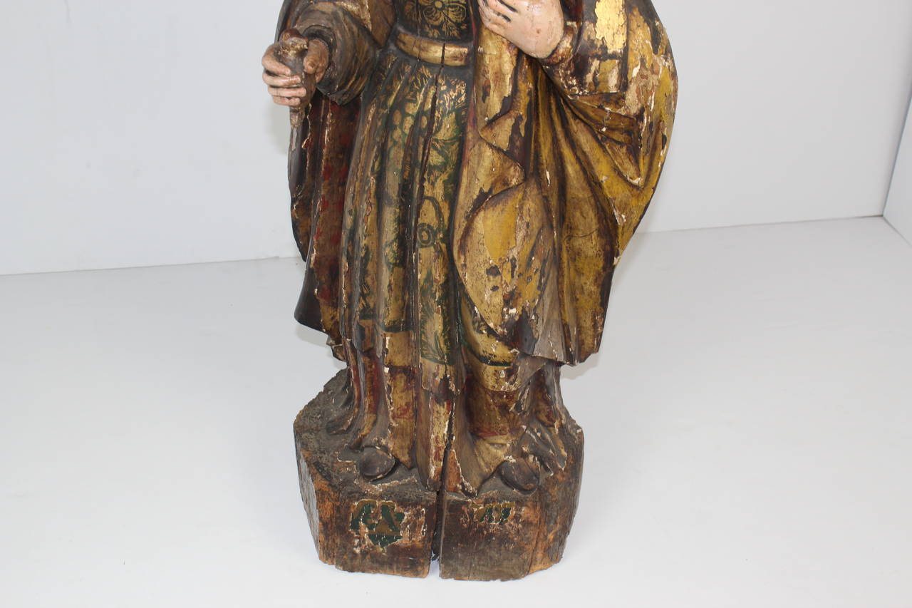 Virgin Mary Santos sculpture in gilt and poly chromed carved wood.