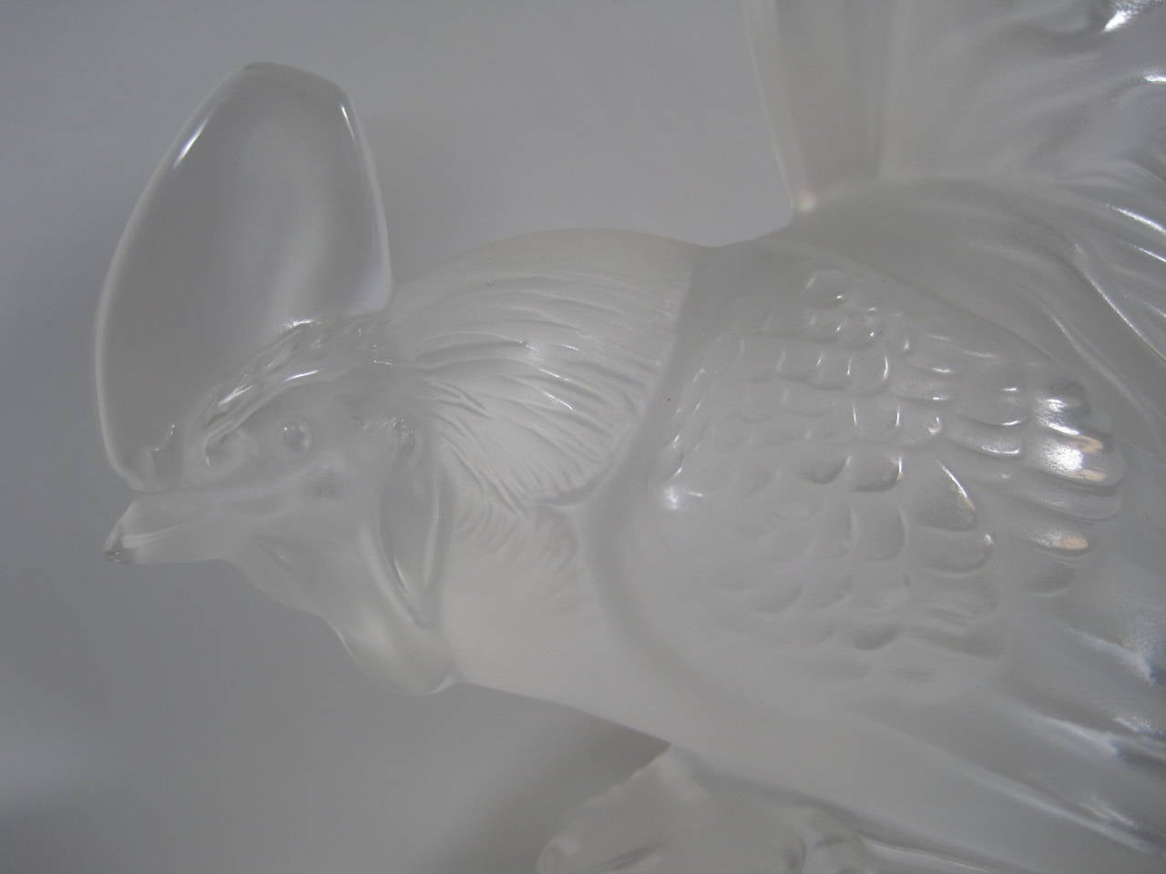 A crystal Rooster paperweight made by Lalique, Paris France. The bull is frosted the base is clear. The base is engraved and signed ‘Lalique France.
