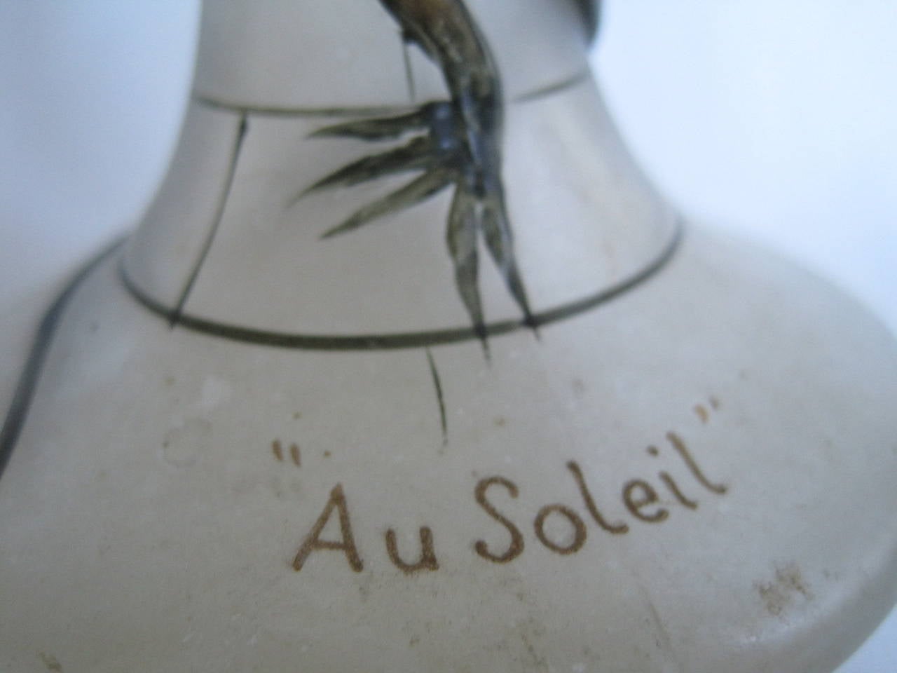 Designed by Maurice Depinoix in 1912, France. This green and white frosted glass bottle for Lubin's 