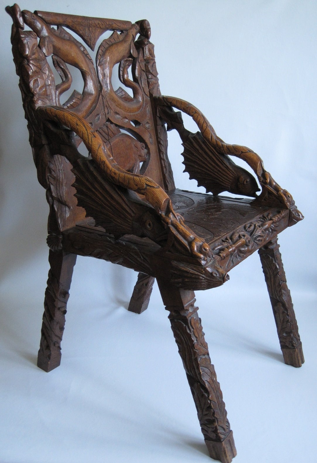 Folk Art chair signed AJW 1900. Heavily carved from top to bottom. Believed to have come from the east coast of North America.

Free shipping within the United States and Canada.