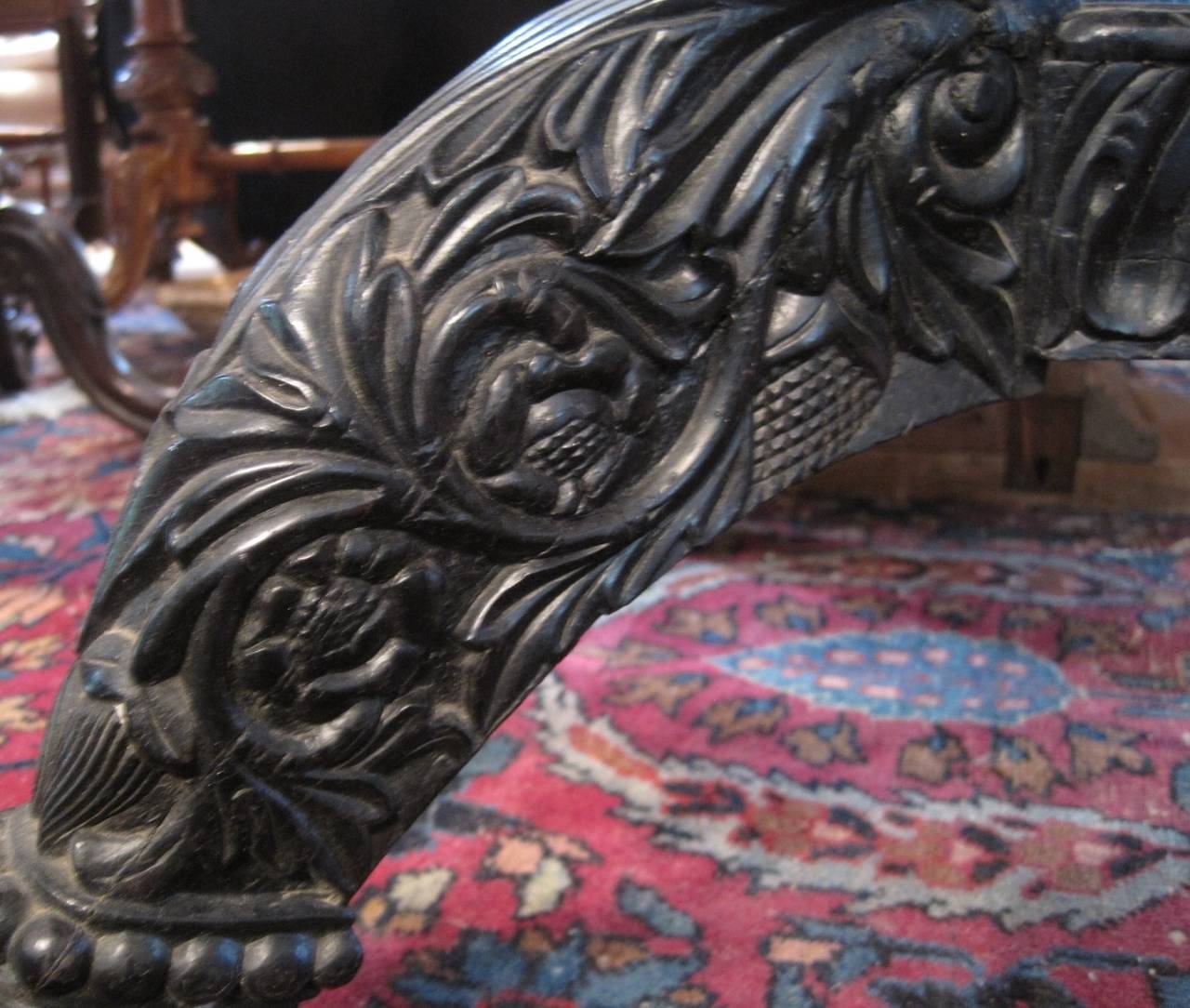 19th century Ceylonese carved ebony dining table, Anglo-Indian. Top has been replaced with marble.