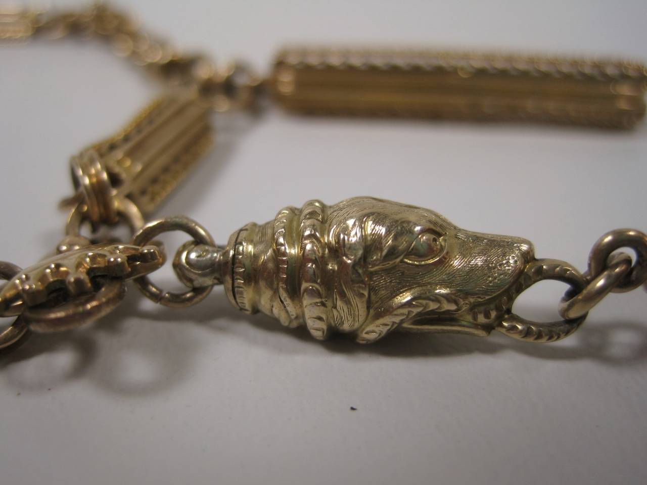 19th century 14-karat gold watch fob chain and pendants.
Weight: 50 grams.

Shipping within the United States and Canada is free.